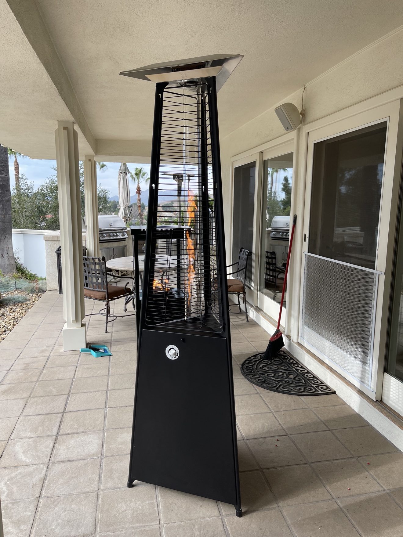 Italkero Falo Evo pyramid heater on a residential patio at night